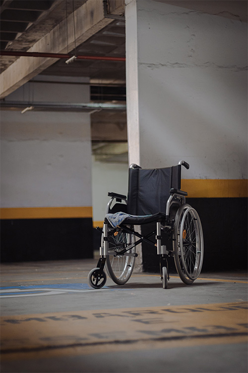 Wheelchair On Handicap Parking Space