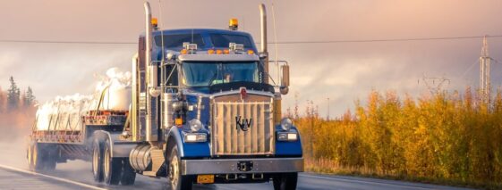 Semi-Truck Driving On Wet Road